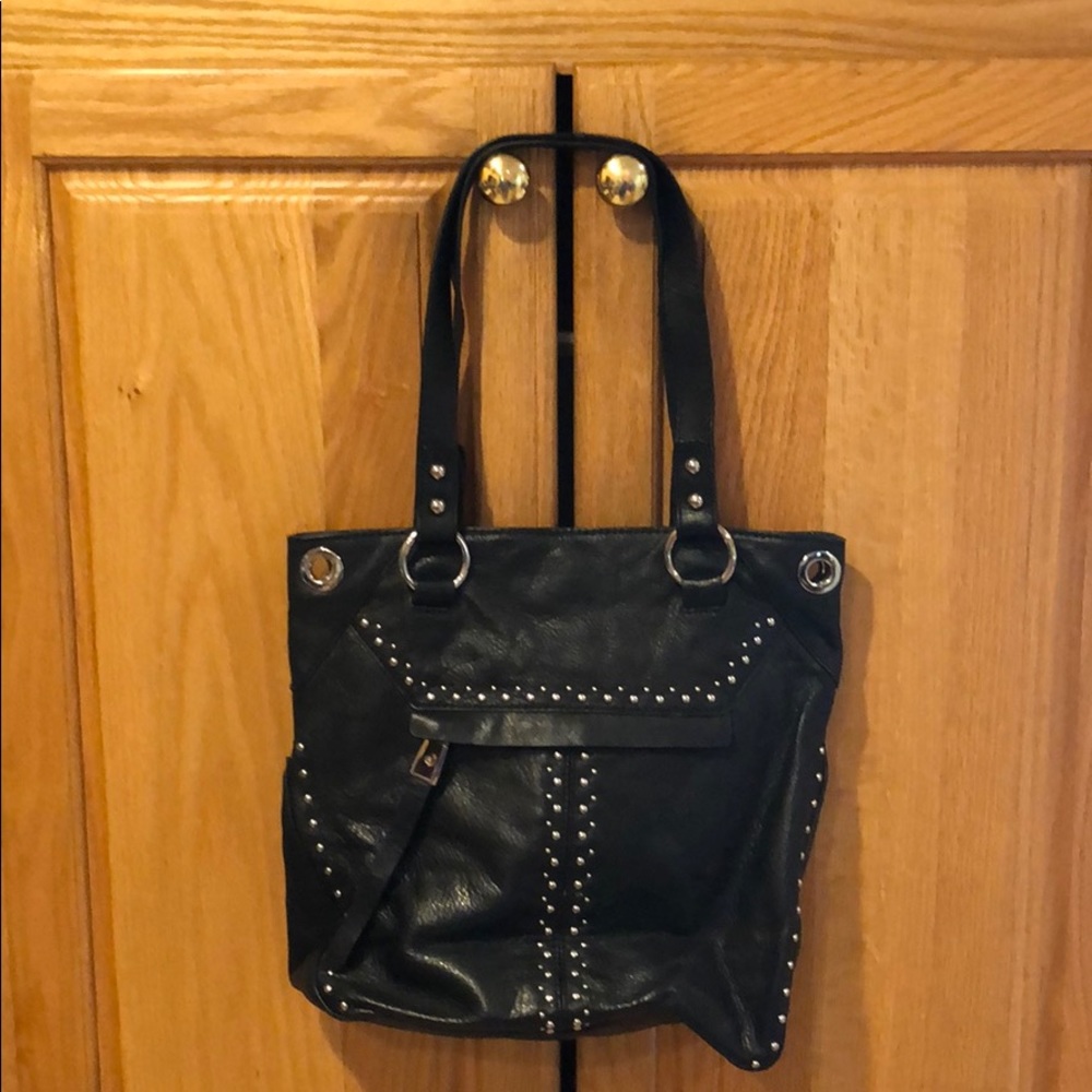 Black leather tote bag with silver stud details
